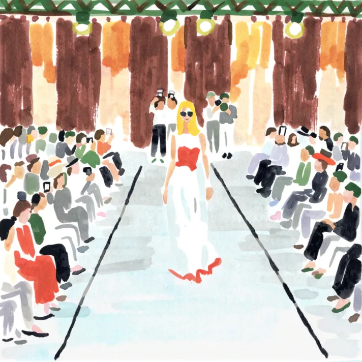 A watercolour of a runway show: a model in a white gown with a red bodice walking between two banked rows of seated guests, photographers at the far end.